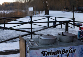 old rusty iron stove in winter