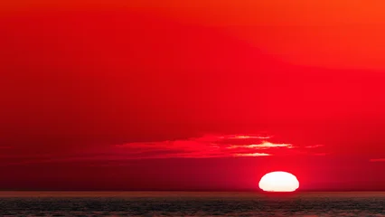 Keuken spatwand met foto Rood Red sunset over sea horizon, stone beach  © Юрий Крылов