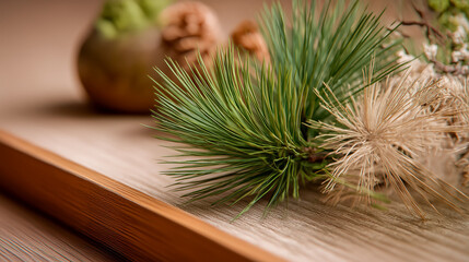 Pine needles on wooden surface with dried branch decor