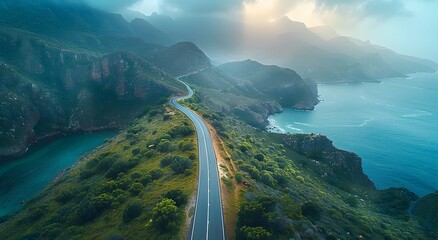 Coastal road winding along rugged cliffs and ocean Photo