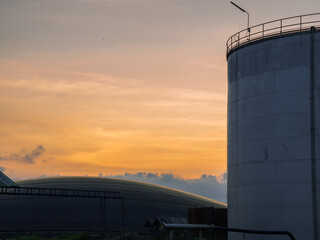 Industrial Crude Oil Chemistry Manufacturing background. Oil refinery chemical factory import and export concept. Chimneys and cooling towers, chemical petrochemical. Storage tank fuel oil industry 