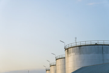 Industrial Crude Oil Chemistry Manufacturing background. Oil refinery chemical factory import and export concept. Chimneys and cooling towers, chemical petrochemical. Storage tank fuel oil industry 