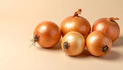 Pile of Golden Onions on a Beige Background.