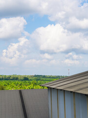 Roof factory view natural background.  Green industry sustainable manufacturing. Industrial carbon reduction and energy saving factory technology concept. Clean air pollution environmental protection 