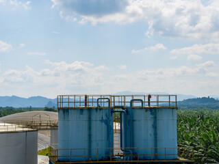 Industrial Crude Oil Chemistry Manufacturing background. Oil refinery chemical factory import and export concept. Chimneys and cooling towers, chemical petrochemical. Storage tank fuel oil industry 