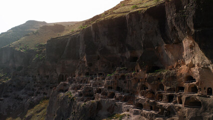 Vardzia — ancient cave city in the rock, touristic place in Georgia, aerial view © Юрий Крылов