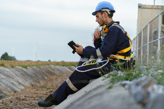 Electrical engineers are checking the operation and power distribution systems within the substation receiving power from the wind farm.	