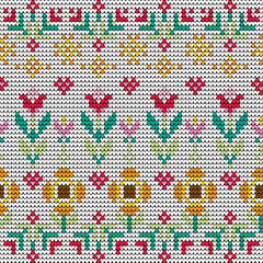 Seamless knitted flower and heart pattern with colorful pixel stitches