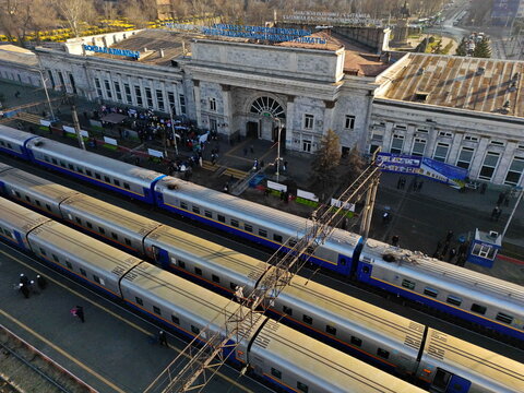 Almaty, Kazakhstan - 11.25.2025 : Railway tracks with passenger trains. Almaty Railway Station-2. The view from the drone.