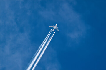 Modern Commercial Airplane Flying High in Clear Blue Sky &ndash; Air Travel, Aviation and Transportation Concept