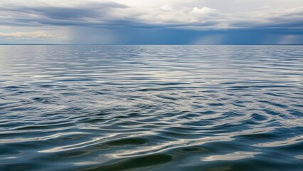 Obraz premium Calm ocean water surface reflection.