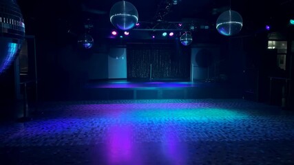 Dynamic led light patterns transforming an empty dance floor with vibrant colors and reflections