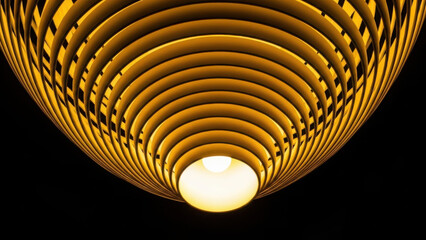 Modern circular ceiling light fixture with concentric golden rings.