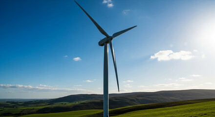 Wind turbine against a bright blue sky and rolling green hills, showcasing clean energy, renewable resources, and environmental sustainability