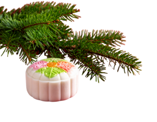 Christmas tree branch with decorative cake
