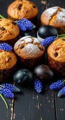 Traditional easter muffins and eggs with blue flowers on rustic table