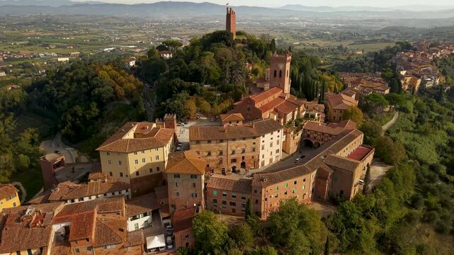 Aerial Flyover of San Miniato Tower: Cinematic Drone View of Hilltop Town and Tuscan Countryside at morning lifgt, 4K 60fps Tuscany Italy