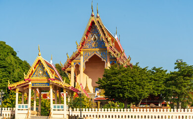 Colorful traditional Buddhist temple with ornate roof and decorative details