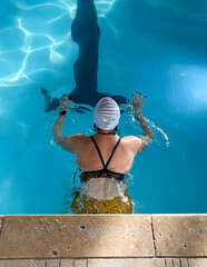 Woman Swims Laps in Pool for Exercise Routine