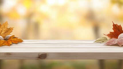 Empty wooden table with autumn leaves and blurred golden fall background
