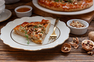 Homemade sweet open pie galette with brie cheese, pears and walnuts
