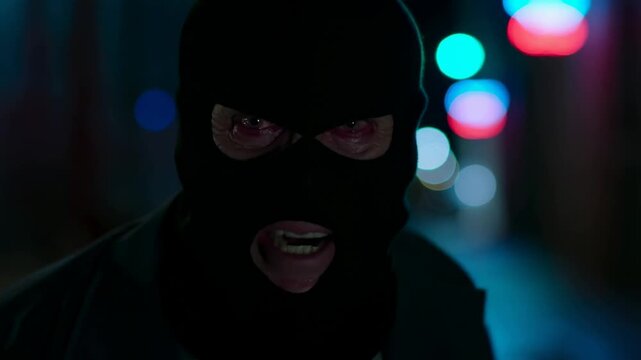 Intense masked intruder and urban night chase with dramatic lighting