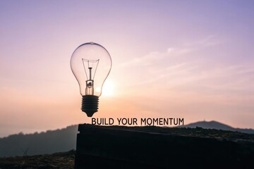 Light Bulb Silhouette Inspires Build Your Momentum in Soft Morning Light
