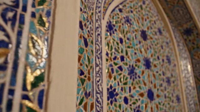 Intricate mosaic pattern with blue, green, and gold tiles