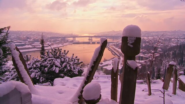 Snow Covered Historic Tombstones With a Stunning Golden Horn View