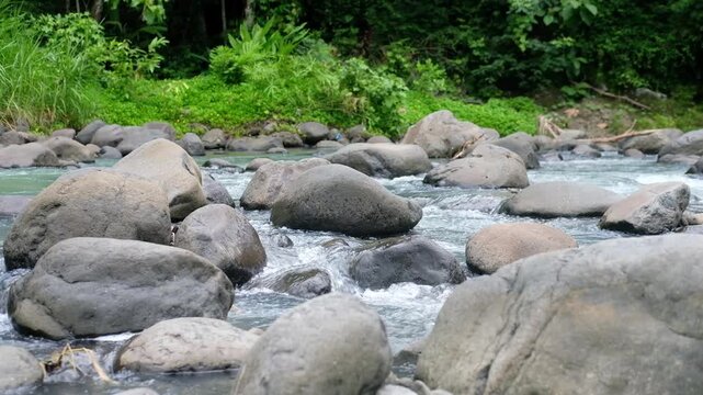 Java, Indonesia, South East Asia: Freshwater River Flow Over Stones in Daylight