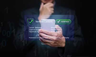 Businessman holds smartphone with verified content check. Digital content authenticity, provenance, authentication, transparency, metadata, cybersecurity, data protection, and online verification.