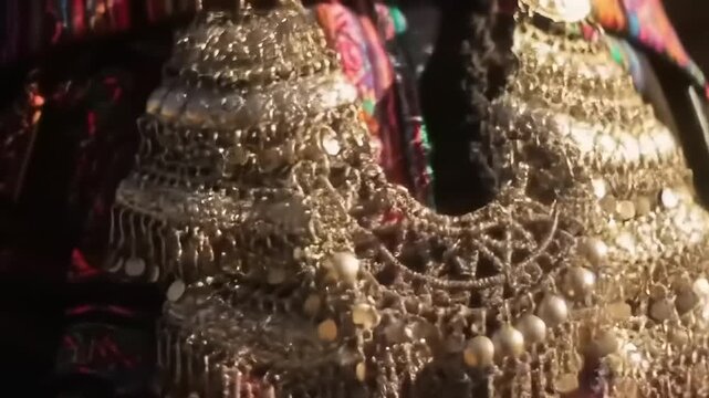 Womans ornate silver necklace.