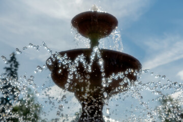 Fountain jets in a summer park on a sunny day