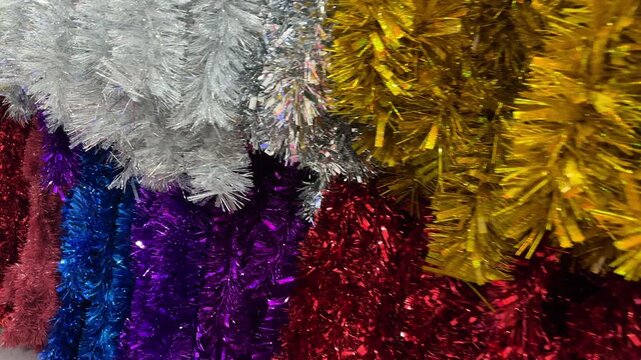 Christmas multicoloured tinsel background. 4K