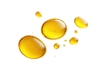 Oil droplets float on a white background showing different sizes and shapes of drops during a creative display of liquid