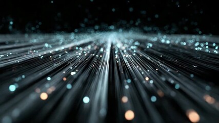 Visual display of flowing light particles in a dark space with various colors and patterns extending outward in high quality 4k resolution