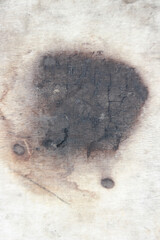 Wood Texture Stain: An abstract and evocative close-up shot of a wood surface, stained with a dark, enigmatic mark, evoking a sense of history, mystery and raw texture.