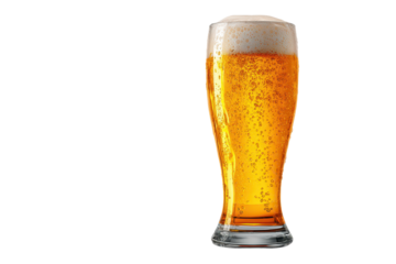 Cold beer served in a glass with bubbles and foam on top in a simple setting during an evening gathering