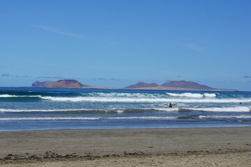 View on La Graciosa from Lanzarote, famara cliff, famara, lanzarote, canary islands, spain, November 2025, holiday, rocks, volcanic island, famara beach