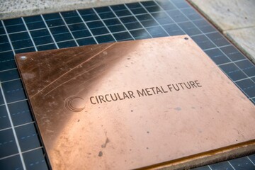 Copper metal plate with circular future text