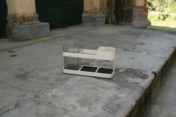 White Multi-Compartment Organizer on Concrete Outdoors