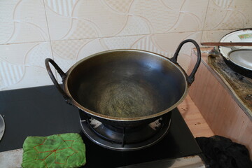Empty Wok on a Gas Stove in a Kitchen