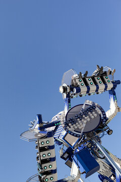 Funfair attraction and blue sky at the amusement park