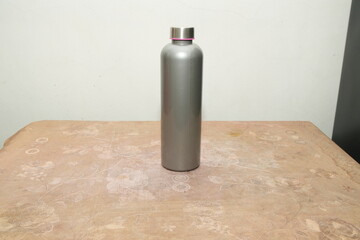 Sleek Grey Reusable Water Bottle on a Textured Table