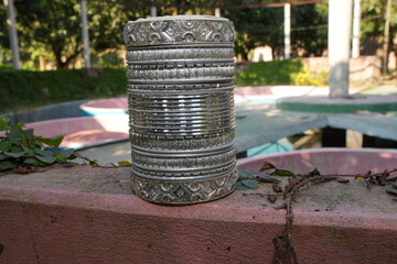 Ornate Silver Bangles Stacked Outdoors