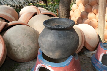 Traditional Handmade Clay Pots Displayed at an Outdoor Market