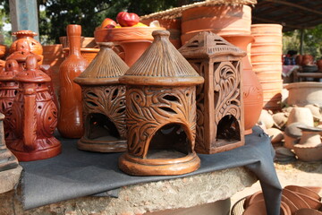 Handmade Terracotta Lanterns and Pots at a Market Stall