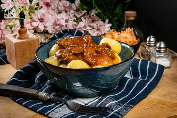 Beef stew in gravy, served with silesian dumplings.