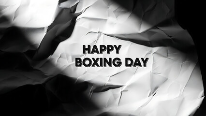 Crumpled paper with Happy Boxing Day message in bold black text
