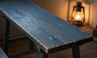 worn blue wooden plank dominates dimly lit room warm golden light spilling nearby lantern casting gentle glow weathered